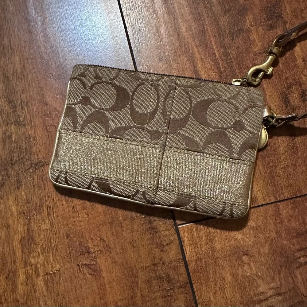 Coach brown and gold sateen horizontal stripe monogram wristlet